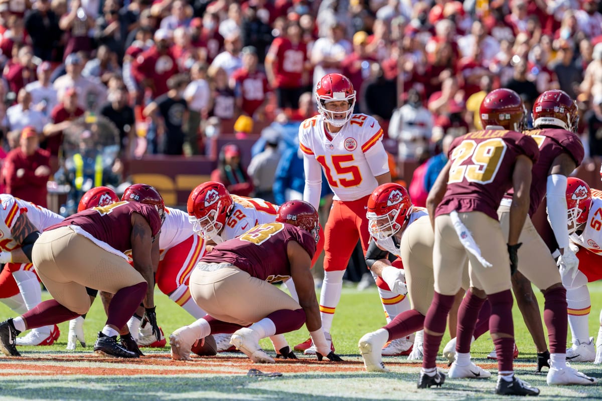 Chiefs quarterback Patrick Mahomes lines up under center in the white road uniform against Washington in 2021