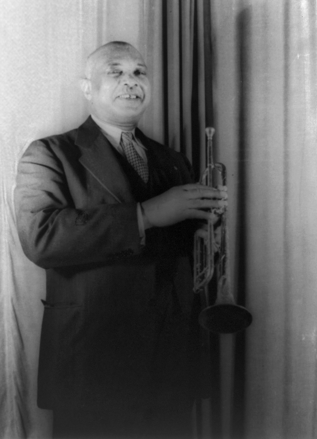 Composer W. C. Handy, writer of 'St. Louis Blues' (1914), holding a trumpet in a 1941 portrait