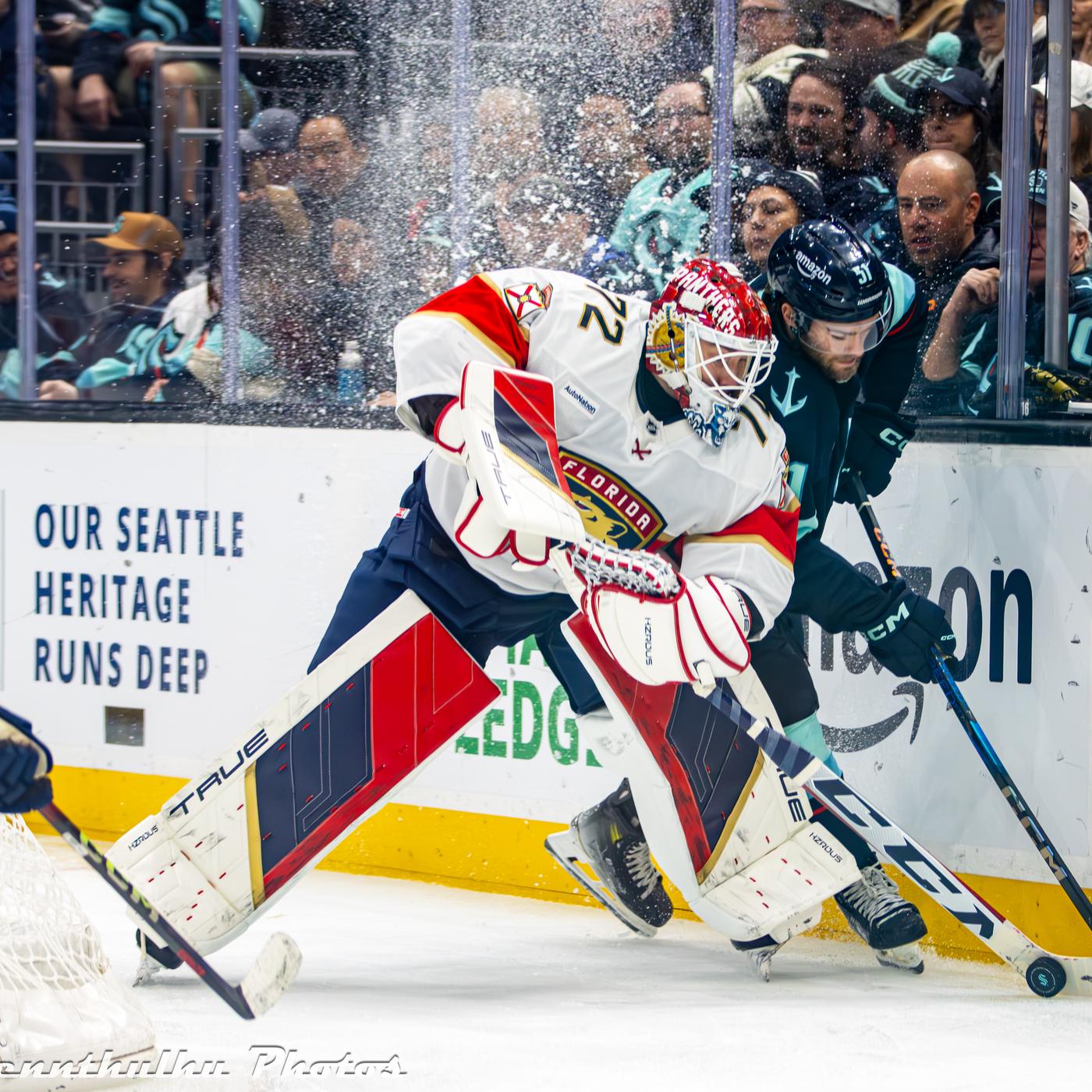 Sergei Bobrovsky plays the puck behind his net in the Panthers' white road uniform with the panther crest and No. 72 at Climate Pledge Arena in Seattle, December 10, 2024