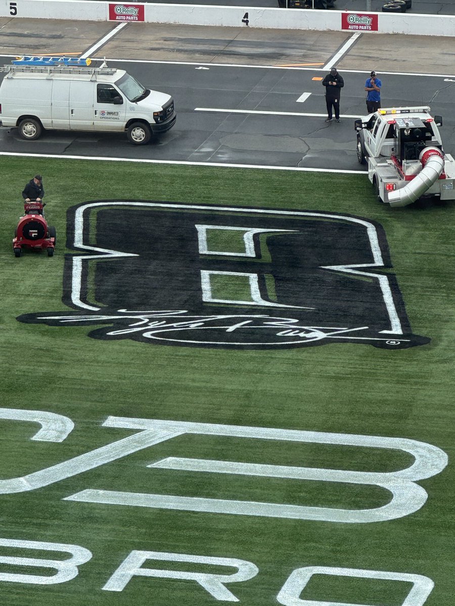 Richard Childress Racing No. 8 logo with Kyle Busch signature painted on the infield grass at Charlotte Motor Speedway for the 2026 Coca-Cola 600 weekend tribute to two-time Cup Series champion Kyle Busch