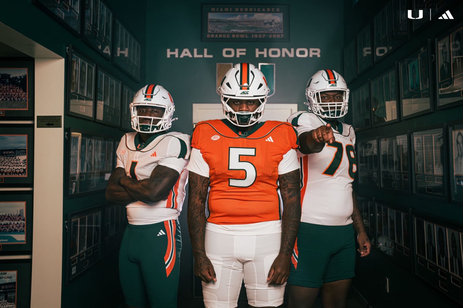 Miami Hurricanes 2001 throwback uniforms, orange home jersey with white pants and white road jersey with green pants, shot in the Hall of Honor