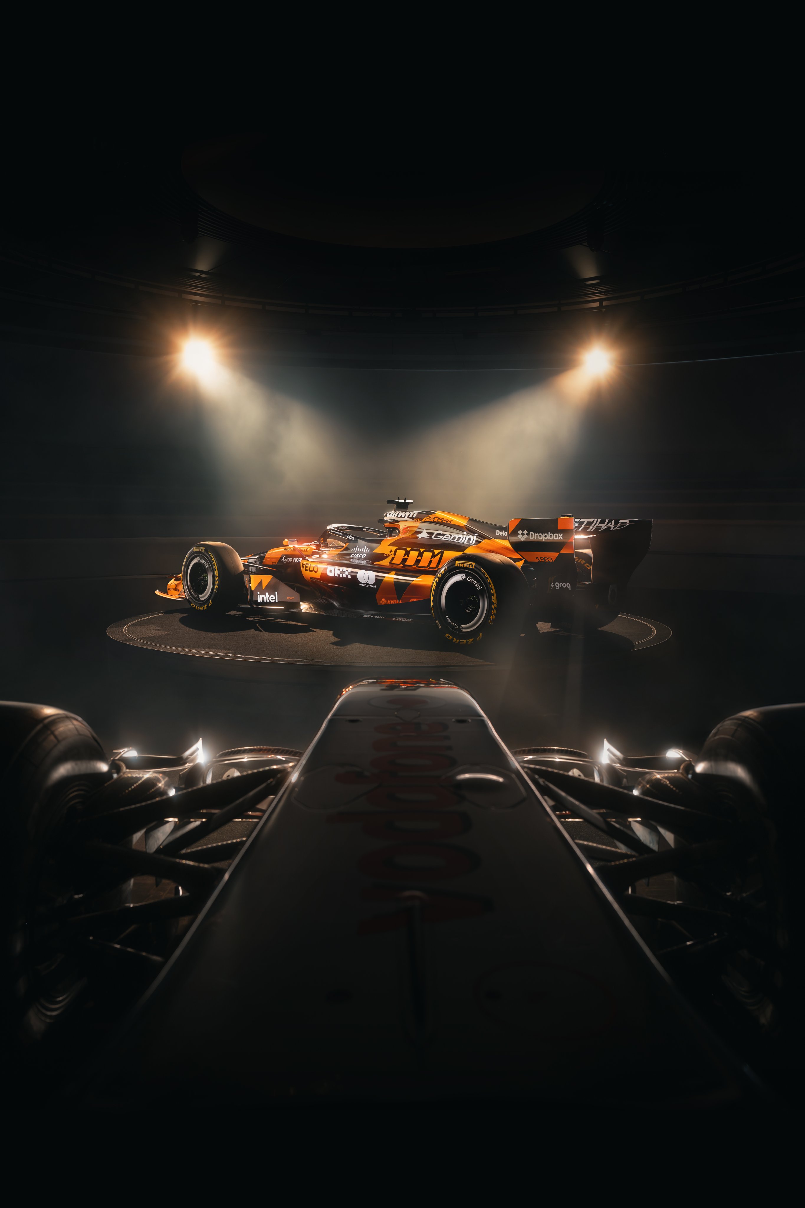 McLaren F1 Monaco Grand Prix 2026 special livery alternate front three-quarter angle of the MCL40 showing the chassis silhouette and the throwback color treatment under studio spotlights