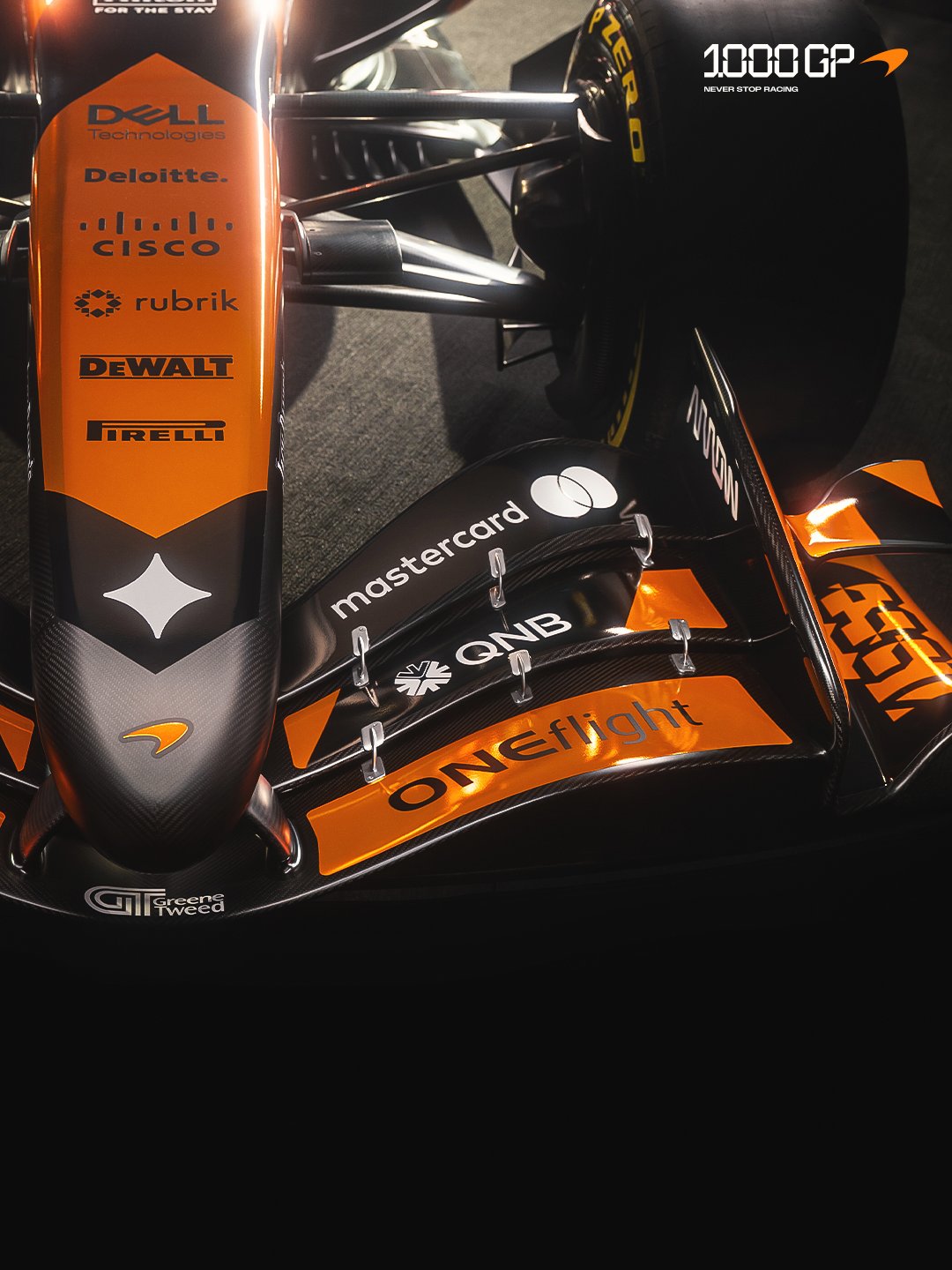 McLaren F1 Monaco Grand Prix 2026 special livery rear three-quarter angle of the MCL40 highlighting the 1976 numerals on the rear panel and the retro paint scheme across the engine cover and rear wing