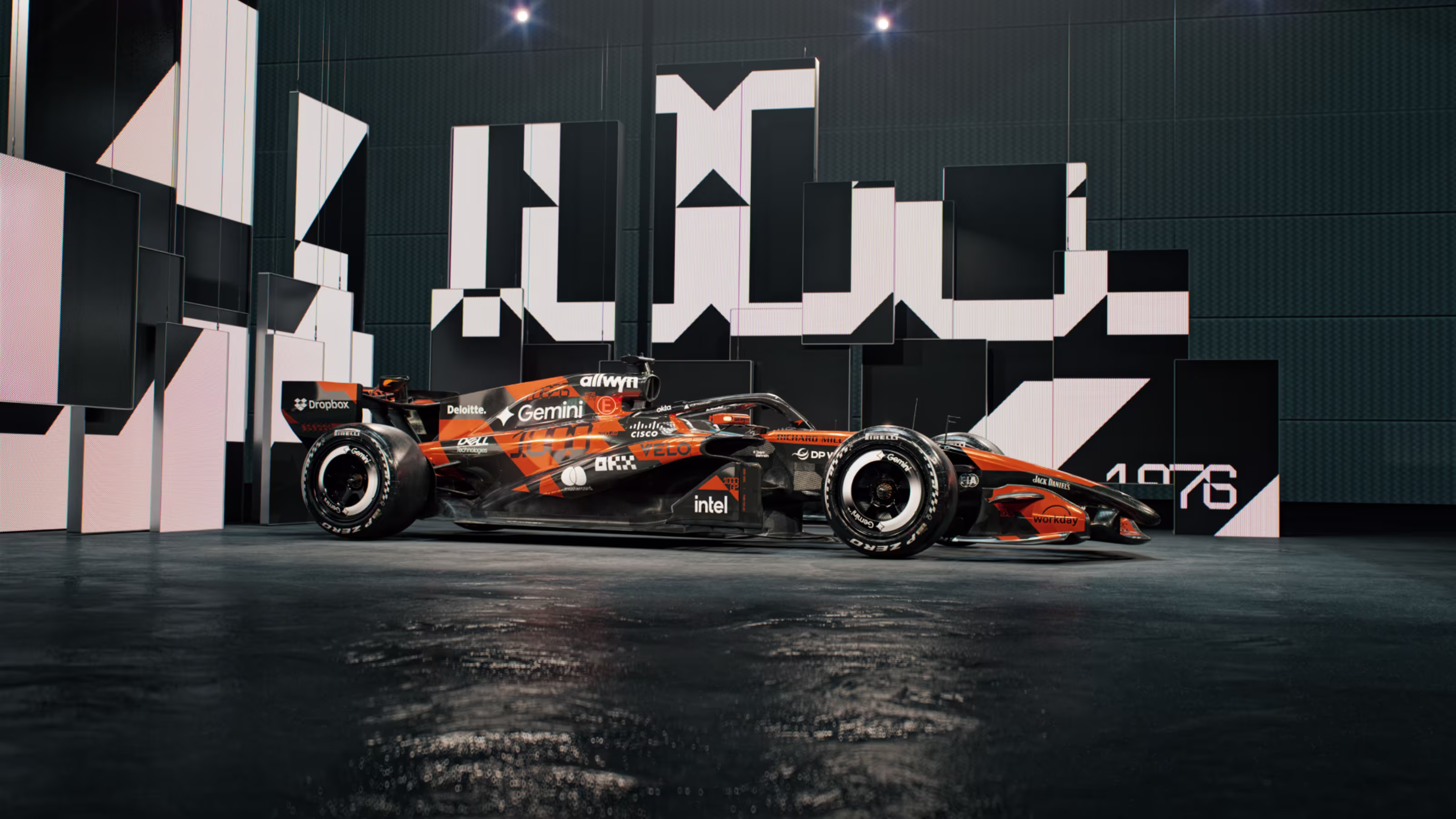 McLaren F1 Monaco Grand Prix 2026 special livery side profile of the MCL40 in retro orange and matte black throwback paint with 1976 numerals on the rear panel set in front of a black and white fragmented McLaren typography wall installation marking the team's 1000th Formula 1 Grand Prix start