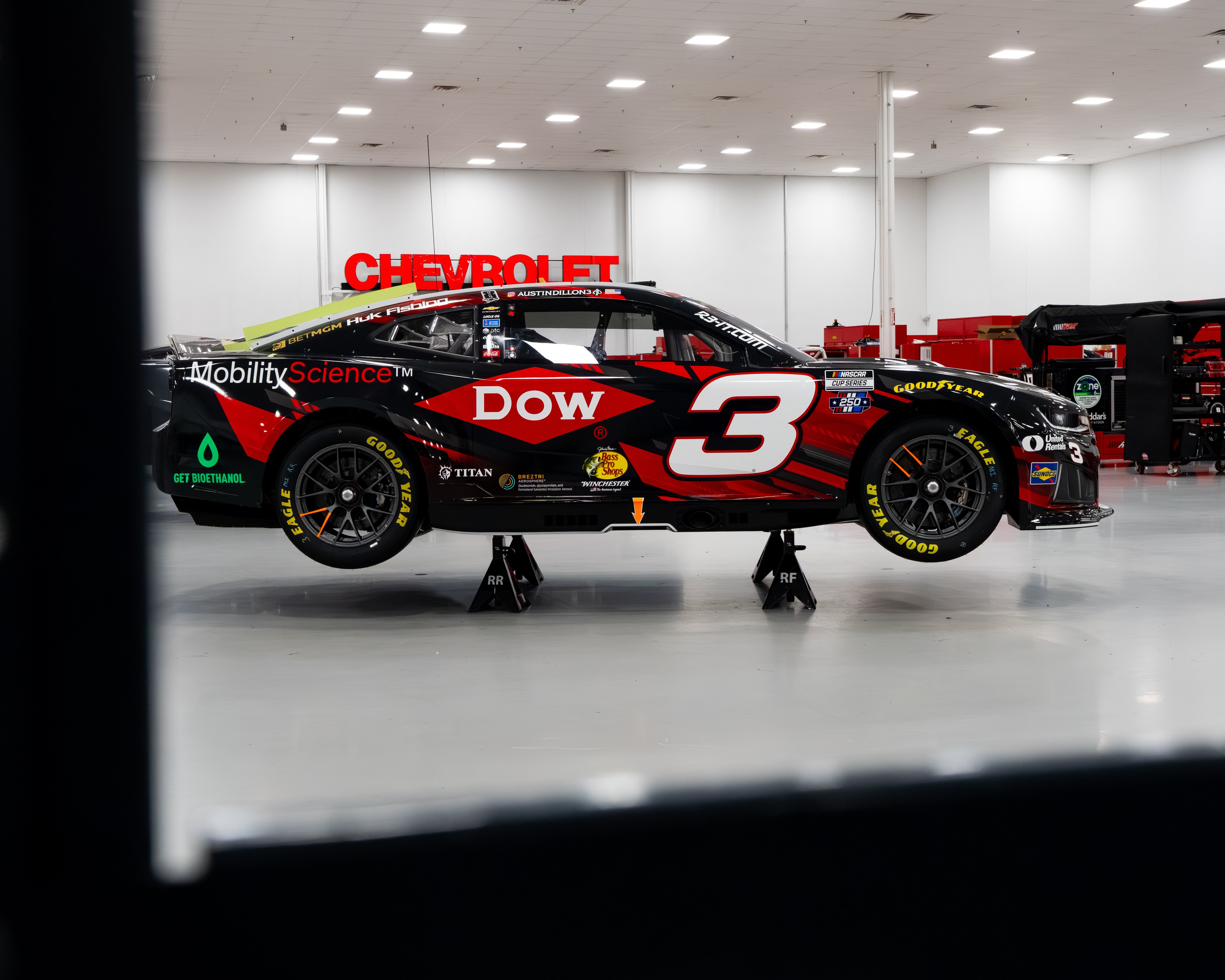 Austin Dillon's #3 Richard Childress Racing Chevrolet for the 2026 NASCAR Cup Series with the Dow primary sponsor wordmark on a black and red panel paint scheme revealed at the RCR shop in Welcome North Carolina