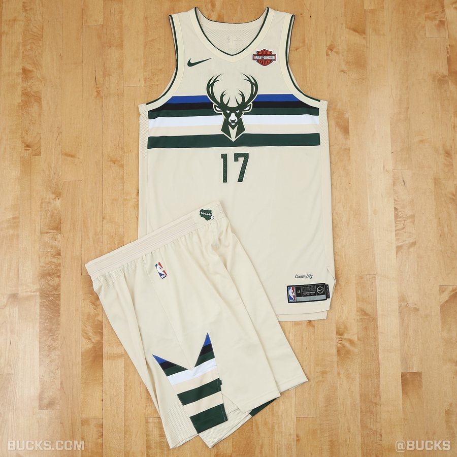 Milwaukee Bucks 2017-18 Cream City City Edition uniform, a cream jersey with the deer head logo over green and blue chest stripes, returning for 2026-27