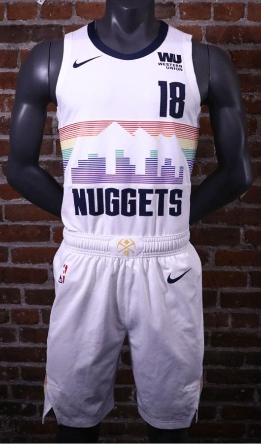 Denver Nuggets 2018-19 City Edition uniform, white with the rainbow Denver skyline and mountains across the chest above a NUGGETS wordmark, returning for 2026-27
