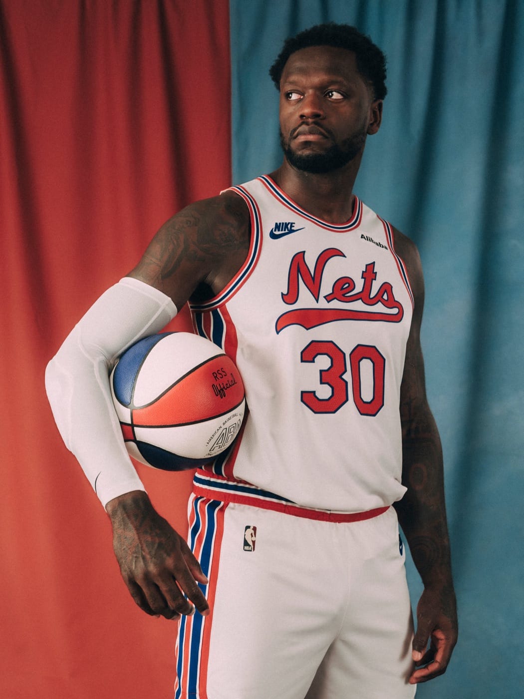 Nets player in the white 2026-27 Classic Edition uniform with the red Nets script, No. 30, holding an ABA ball