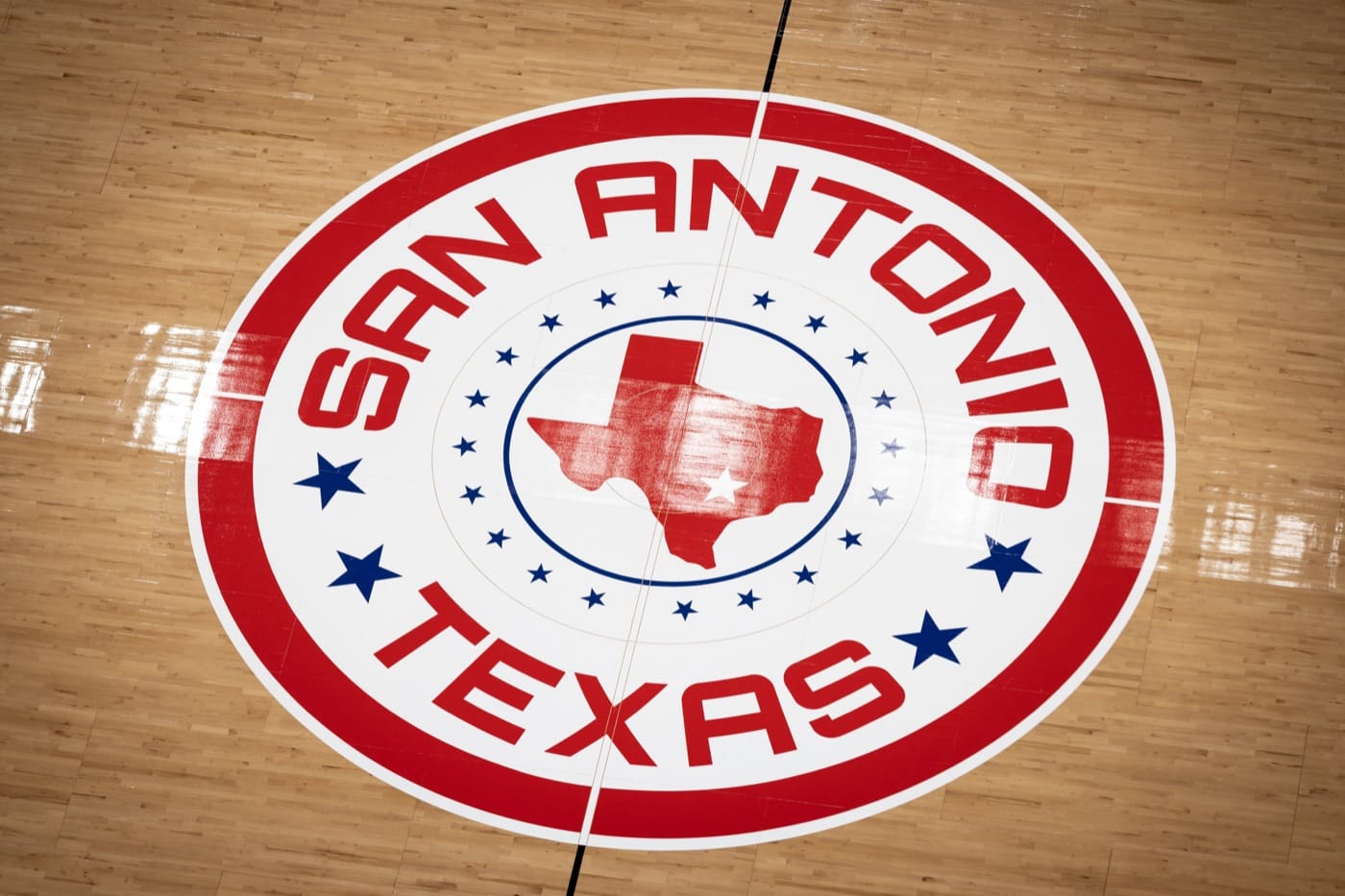 Spurs Classic Edition court center circle: SAN ANTONIO TEXAS in red around a red Texas map and a ring of stars