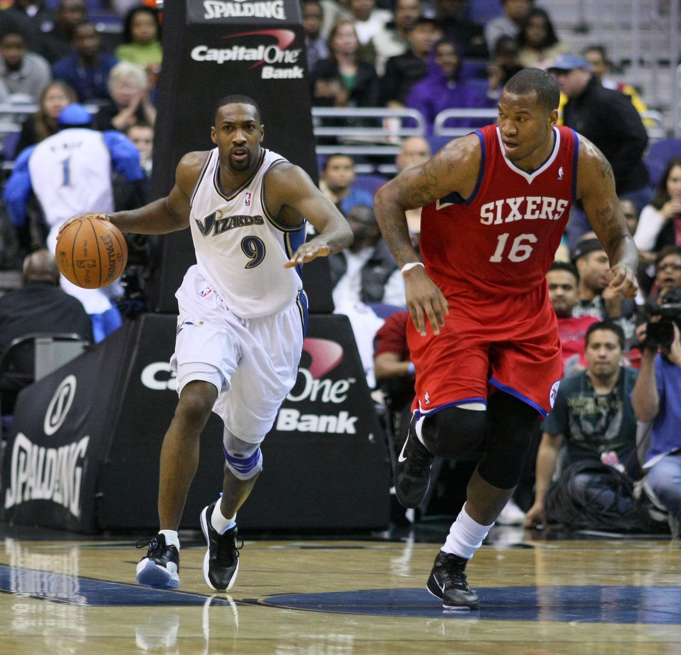 Gilbert Arenas pushes the ball on the break in the Wizards' white home jersey from the blue, bronze and black era, against the 76ers on Nov. 23, 2010, at Verizon Center