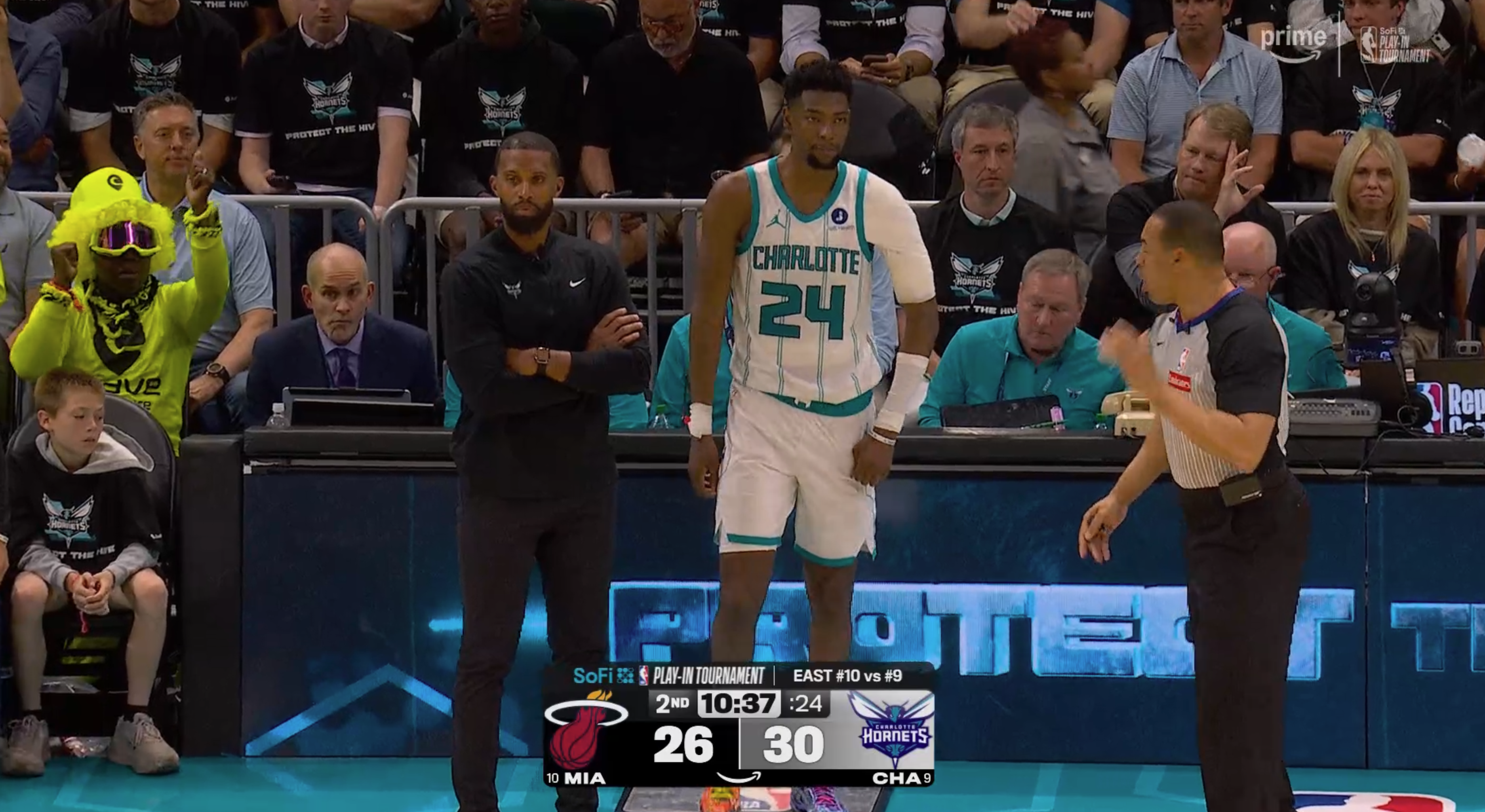 Brandon Miller Charlotte Hornets sideline 2026 NBA Play-In Tournament black playoff t-shirts fans Spectrum Center