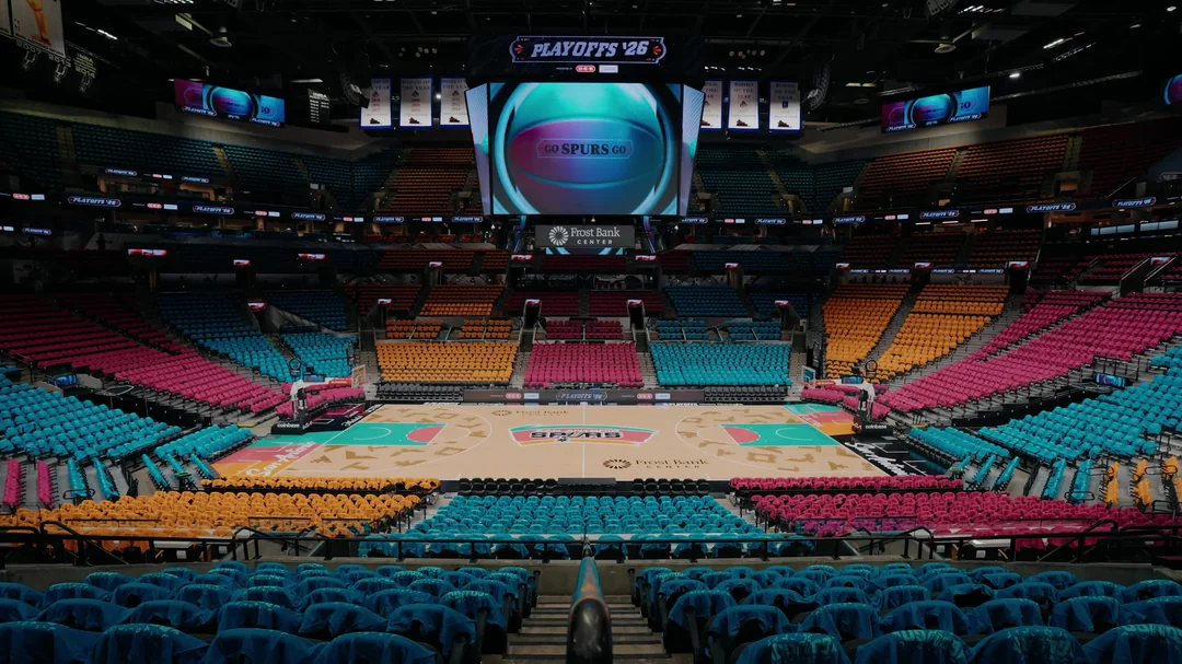 San Antonio Spurs Frost Bank Center Fiesta playoff arena setup with pink teal orange and yellow seat colors and Playoffs jumbotron 2026 NBA Playoffs Round 2