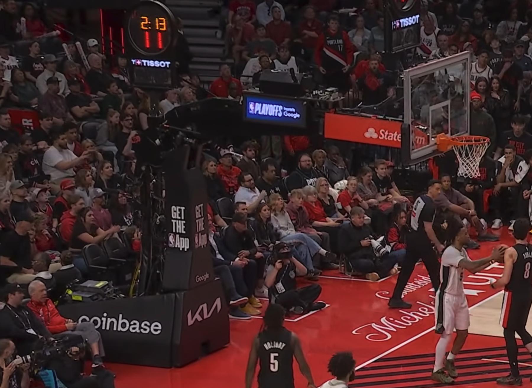 Spurs at Trail Blazers stanchion at Moda Center 2026 NBA Playoffs Round 1 Game 4 with no Playoffs logo branding