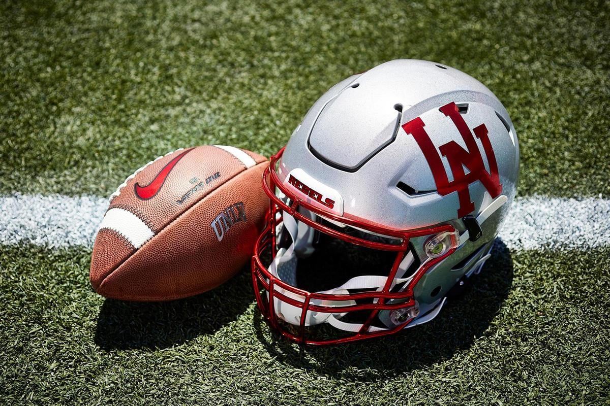 UNLV silver throwback football helmet with red interlocking UN logo, worn in 2019 to honor the 1969-72 design