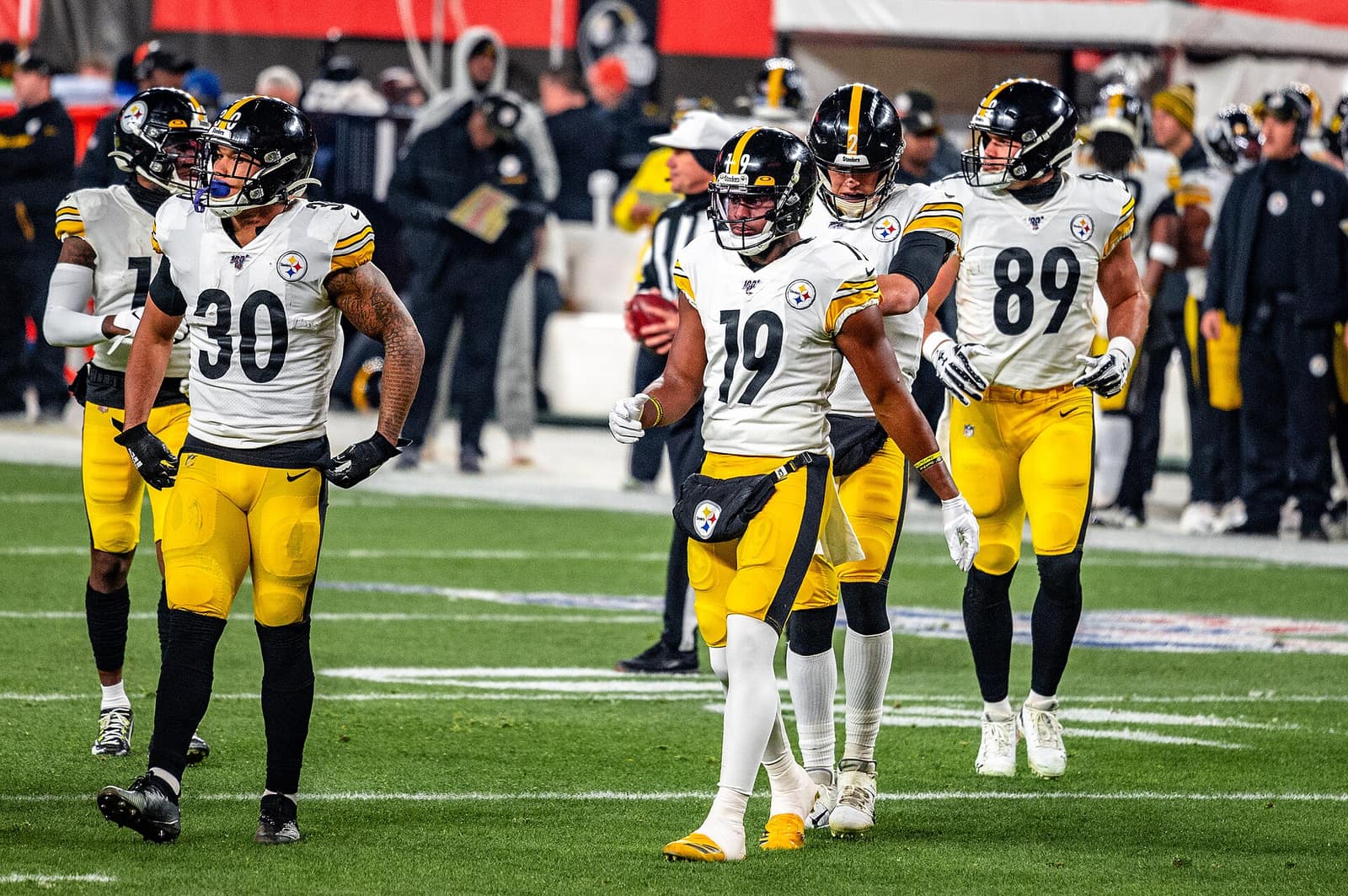 Pittsburgh Steelers in white road jerseys, gold pants and black helmets at Cleveland