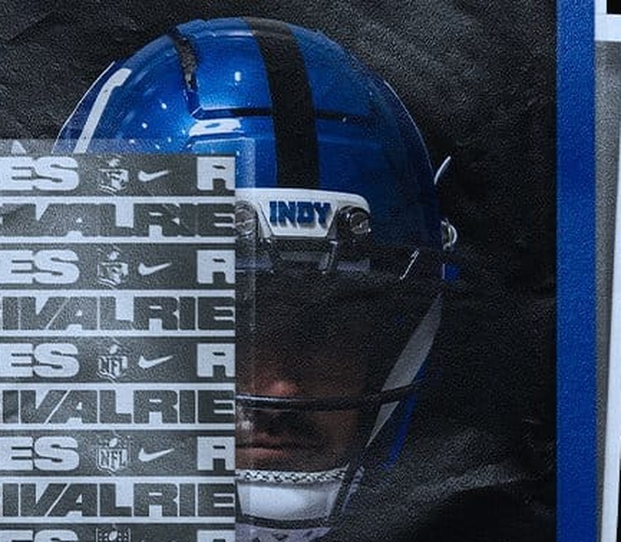 Indianapolis Colts Anvil Strike helmet, a high-gloss metallic royal blue shell with a black center stripe and an INDY front bumper