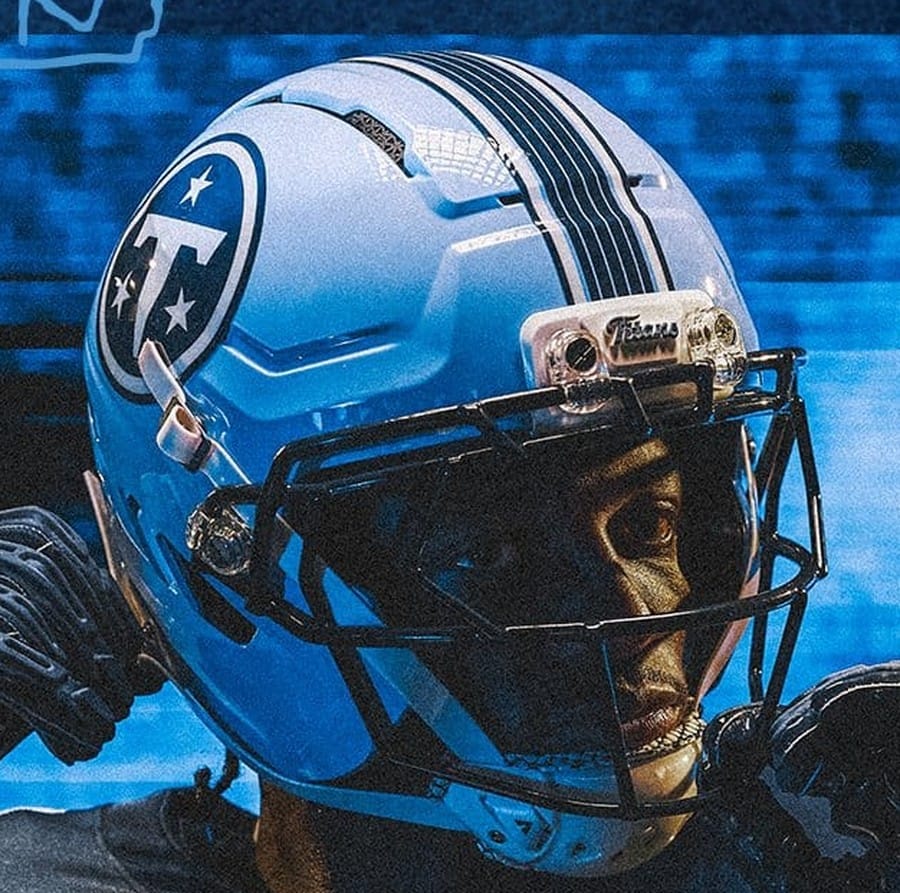 Tennessee Titans Music City helmet, a Titans Blue shell with the circular navy T logo, navy crown stripes and a black face mask