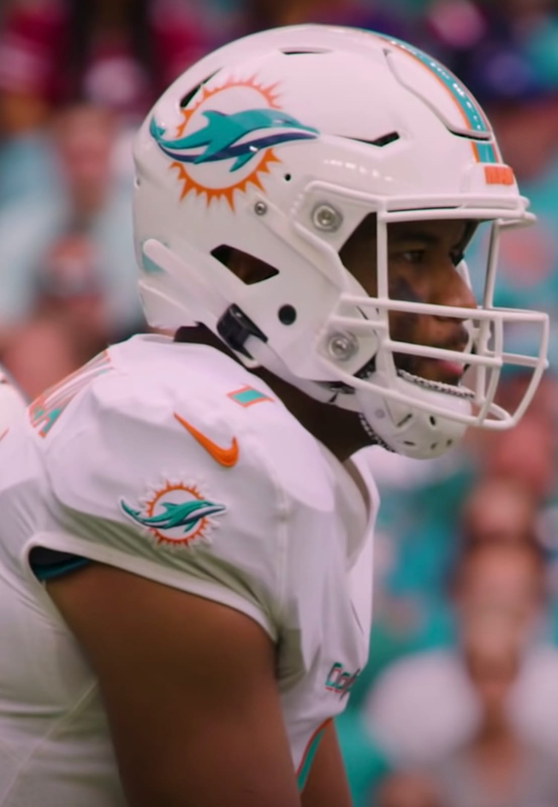 Miami Dolphins quarterback in the white home jersey with the aqua and orange logo on the sleeve at Hard Rock Stadium