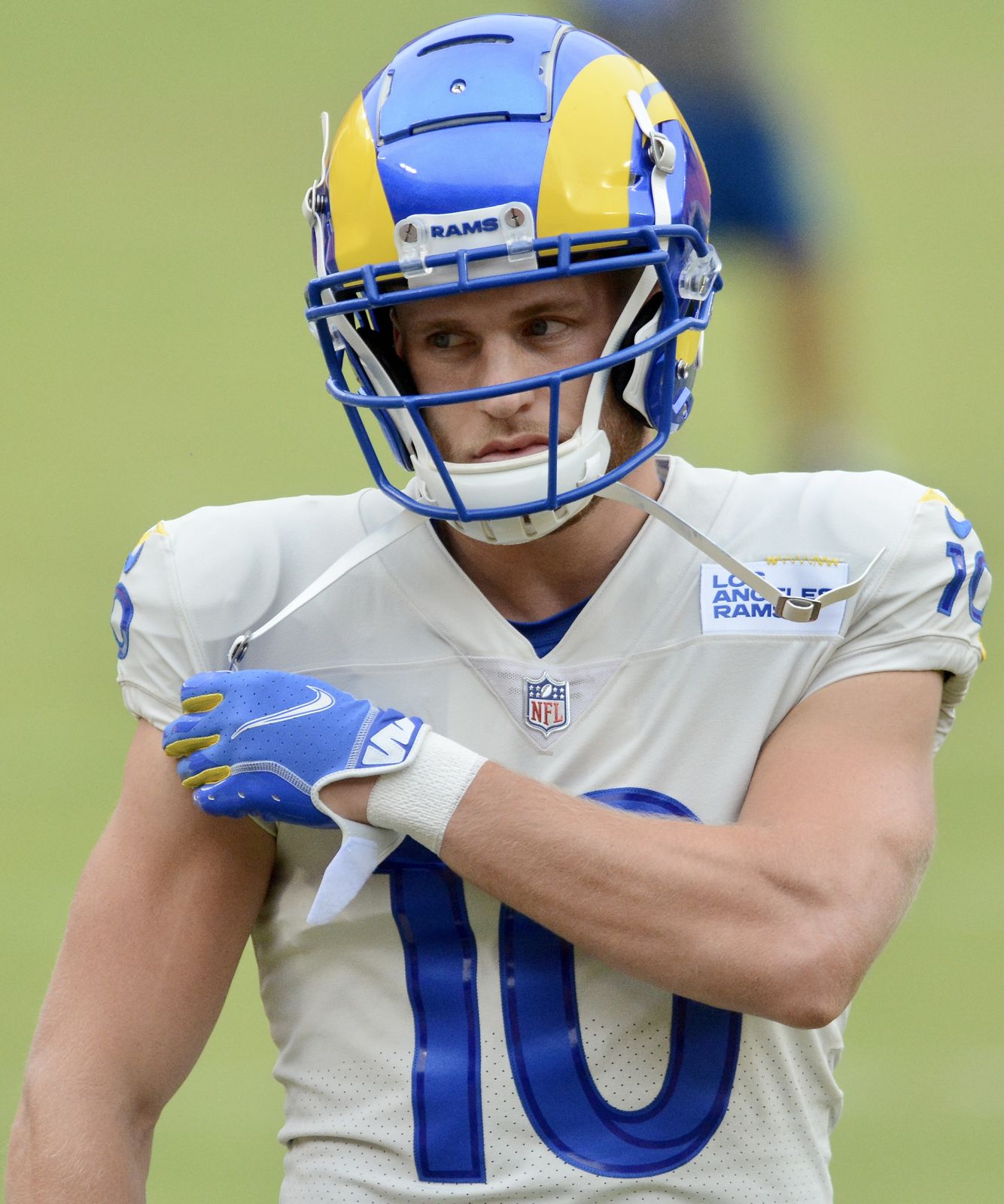 Rams receiver Cooper Kupp in the bone-white road jersey and royal blue helmet with yellow ram horns curling around the ear hole, at Washington in October 2020