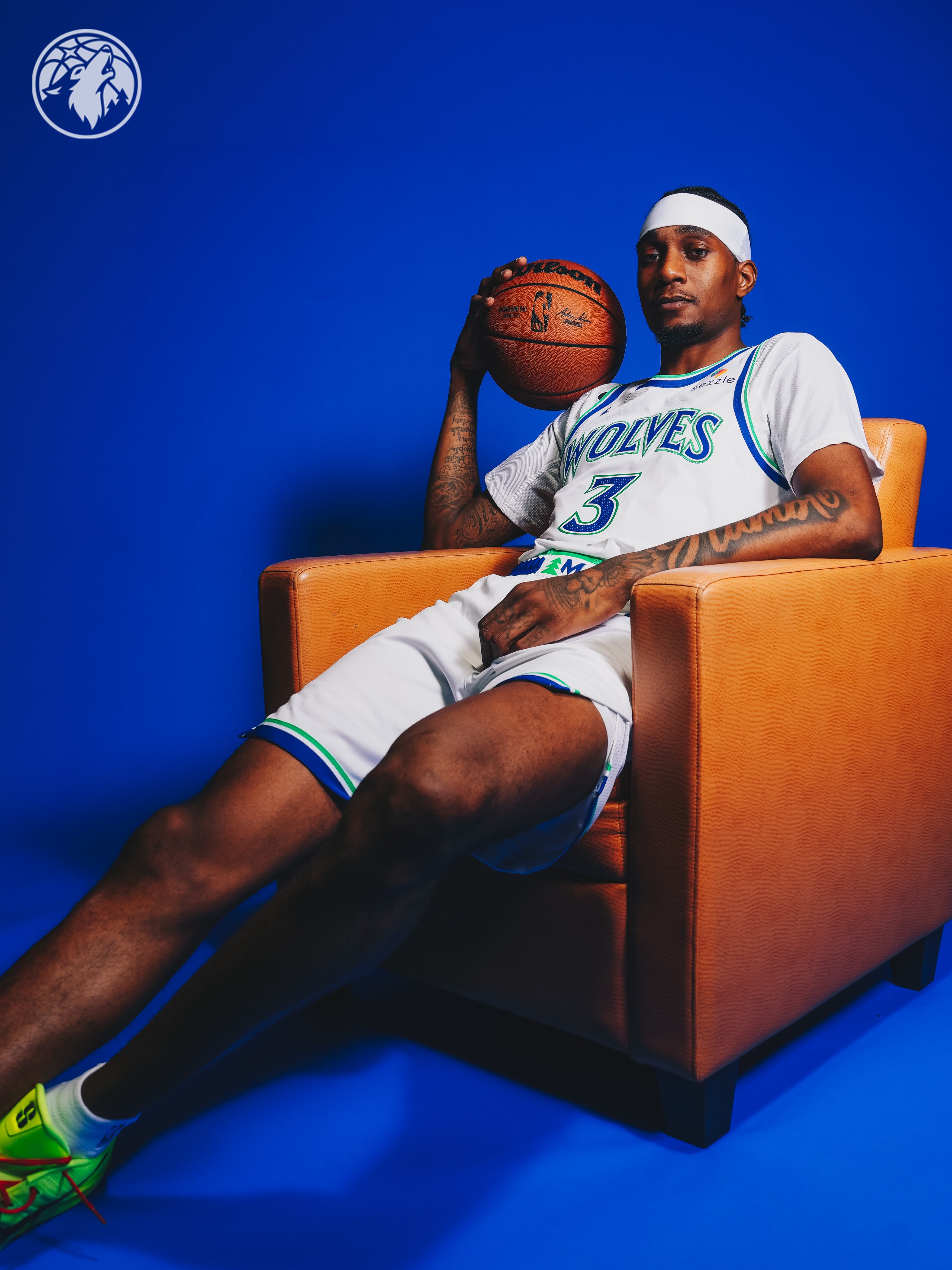 Minnesota Timberwolves new Association Edition white home jersey 2026-27 seated pose with the cut-out detail visible on the side of the shorts, the throwback short hem cutaway returning as a design quirk and one of the standout details of the new Wolves uniform set