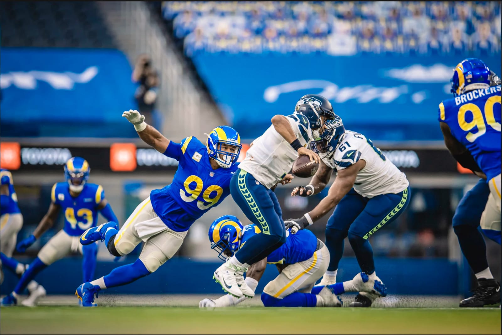 Aaron Donald 99 in Los Angeles Rams blue home uniform with gradient numbers