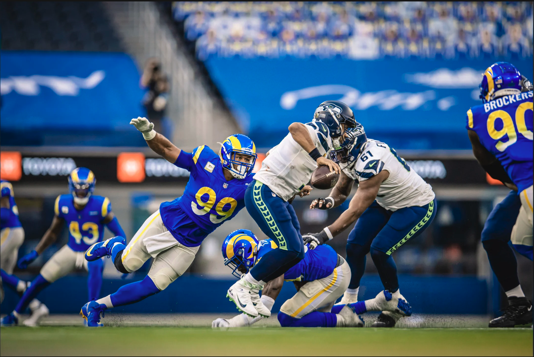 Aaron Donald 99 in Los Angeles Rams blue home uniform with gradient numbers