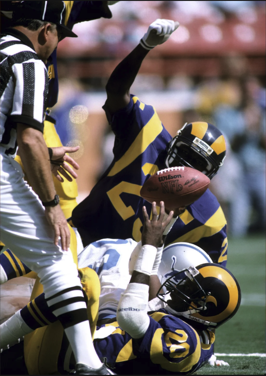 Vintage Los Angeles Rams players in classic blue and yellow uniforms
