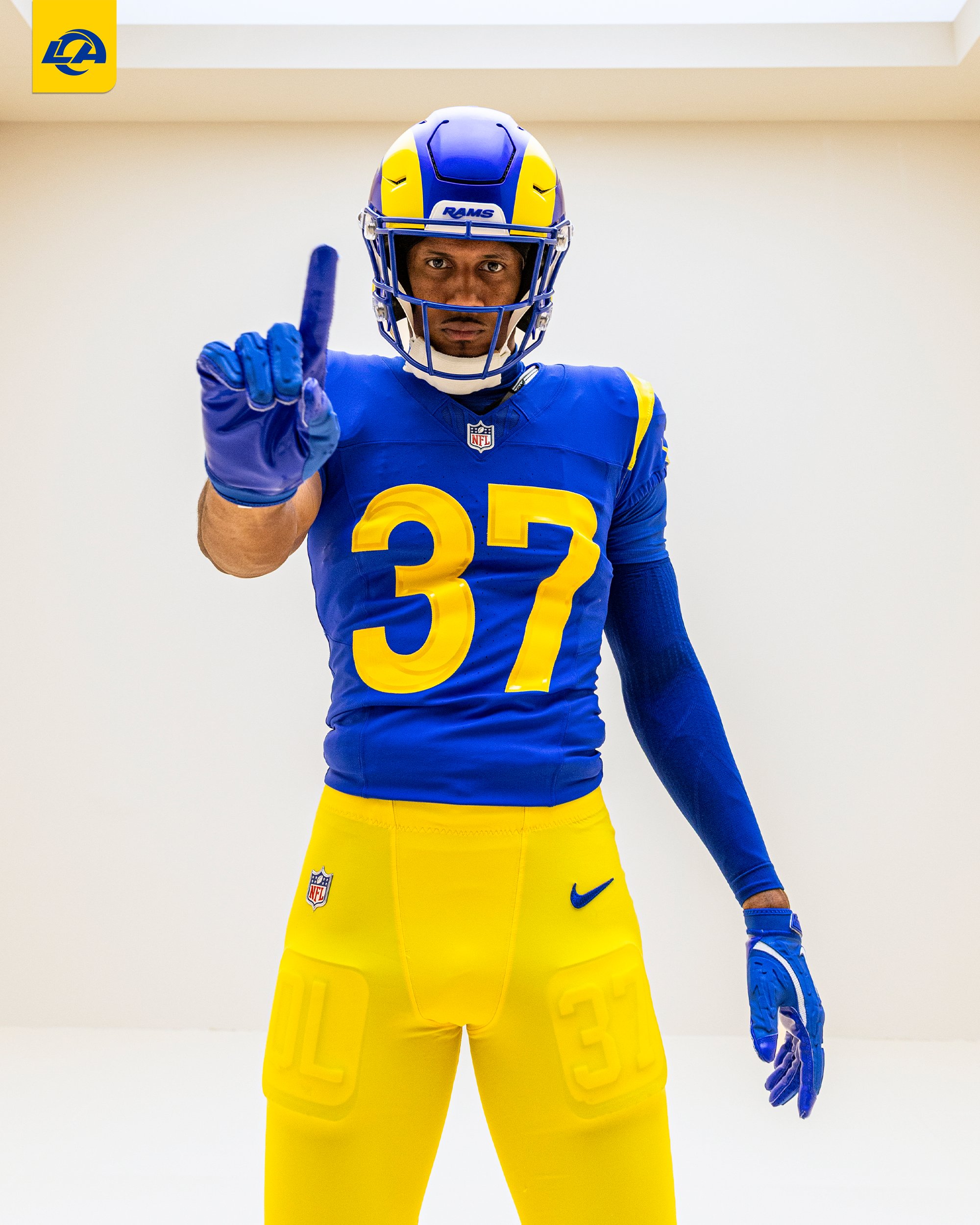 Los Angeles Rams player in new 2026 blue home uniform pointing up