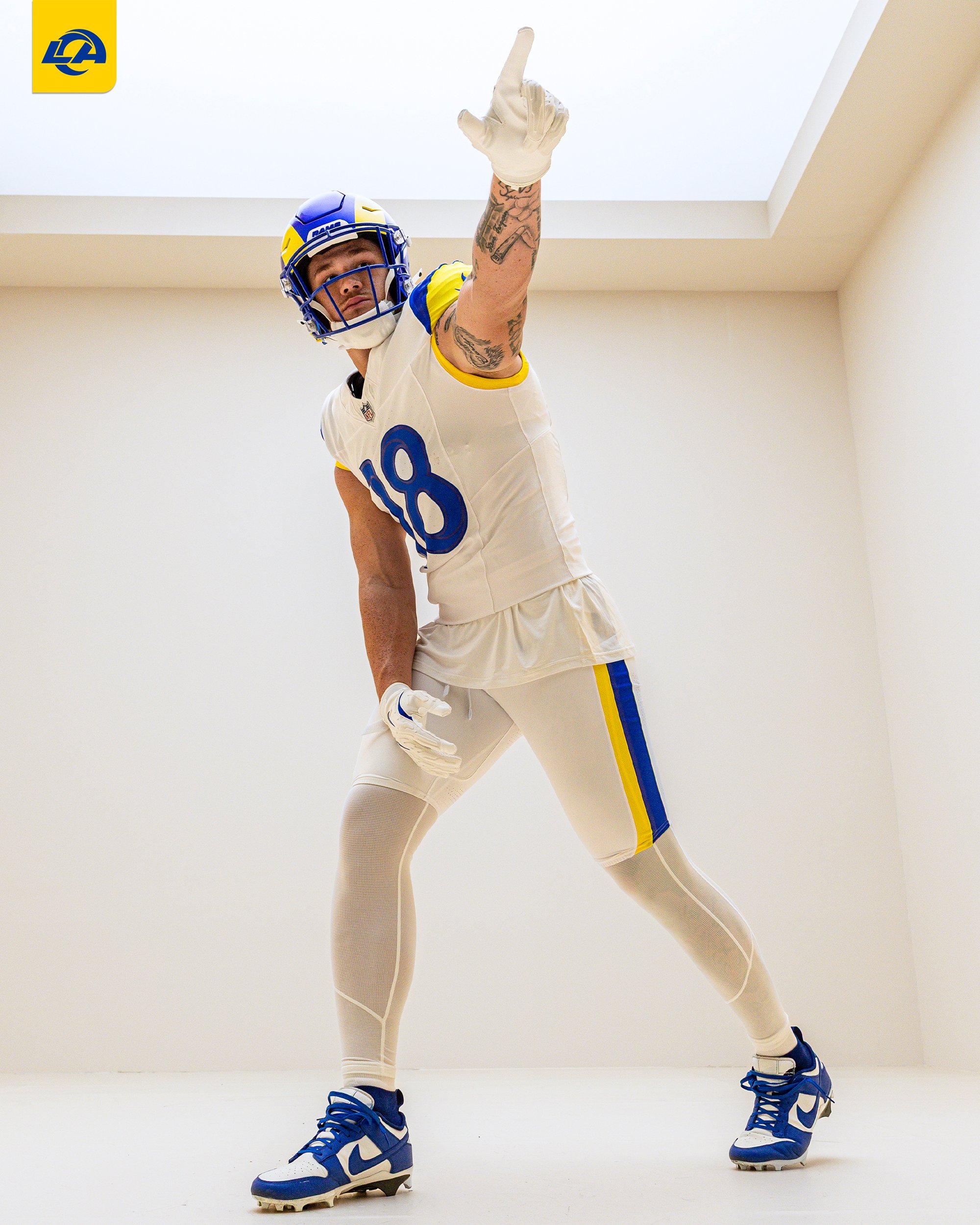 Los Angeles Rams player number 18 posing in new 2026 white away uniform pointing up