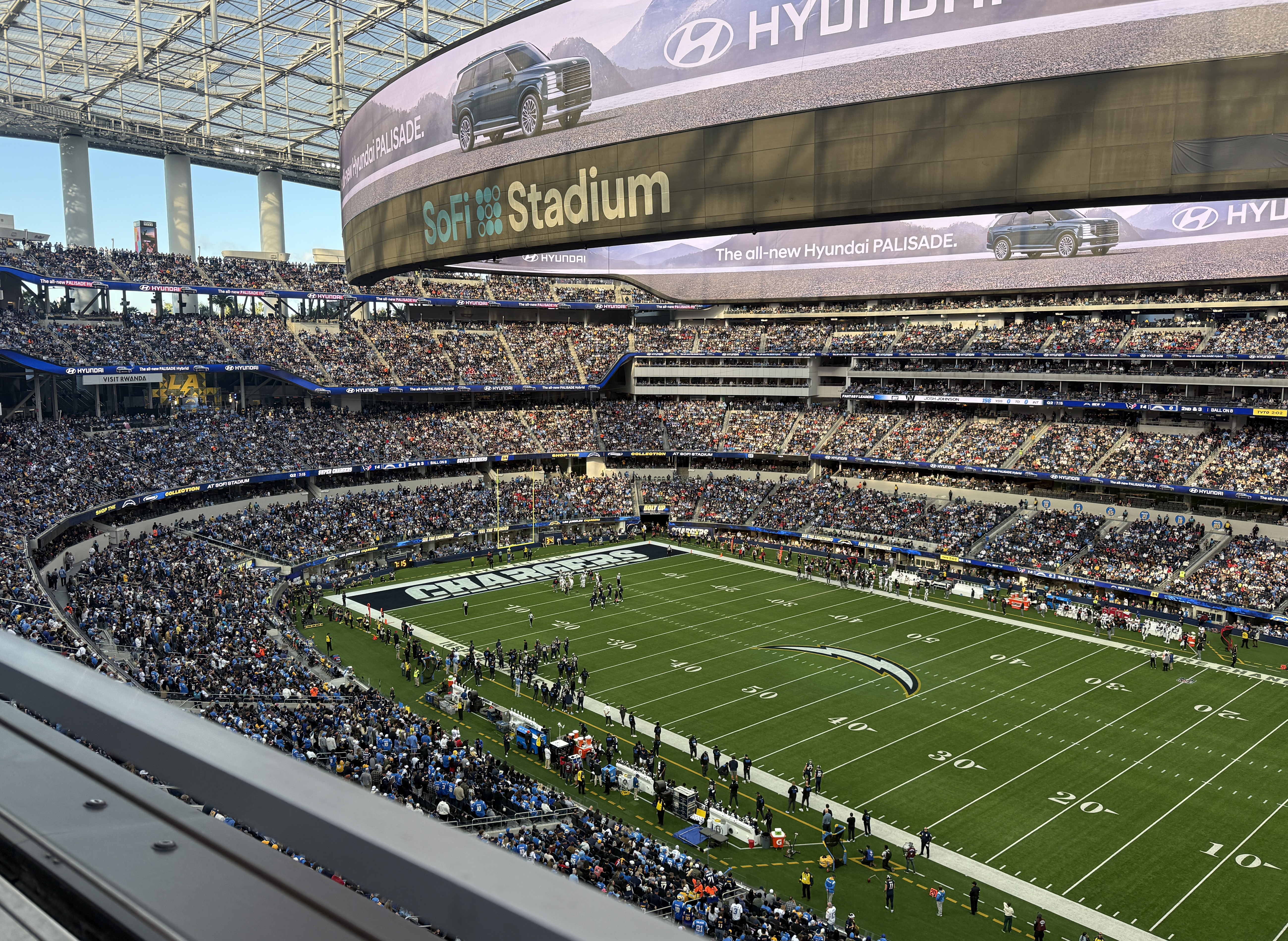 SoFi Stadium interior showing open-air design with translucent roof