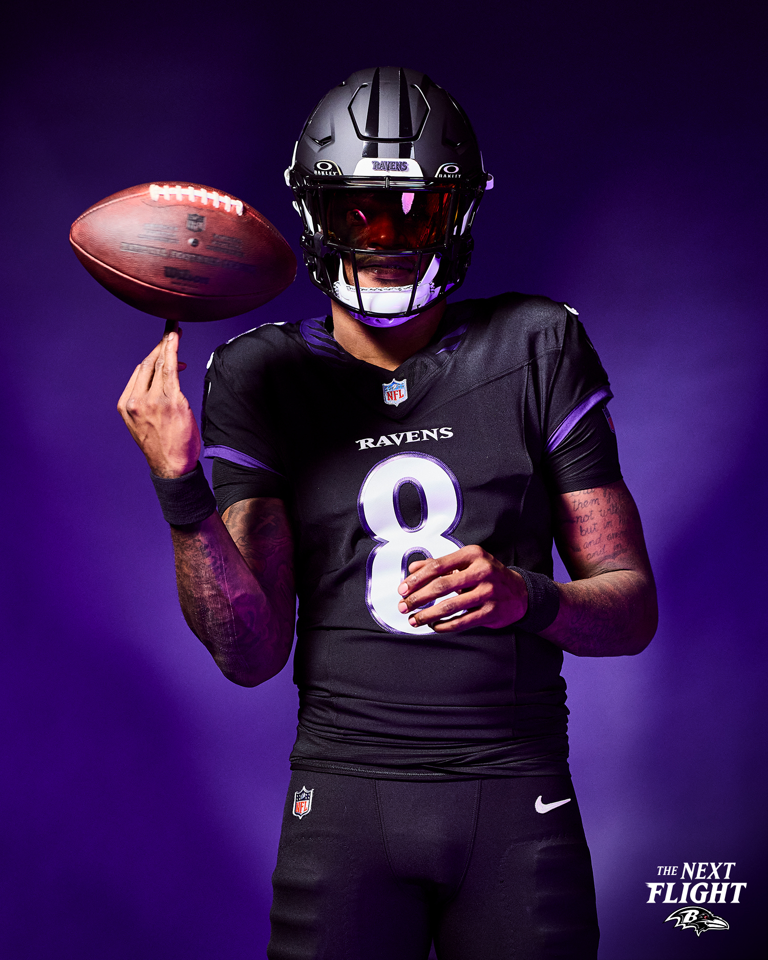 Baltimore Ravens Lamar Jackson wearing new 2026 Darkness alternate all-black uniform with matte black helmet