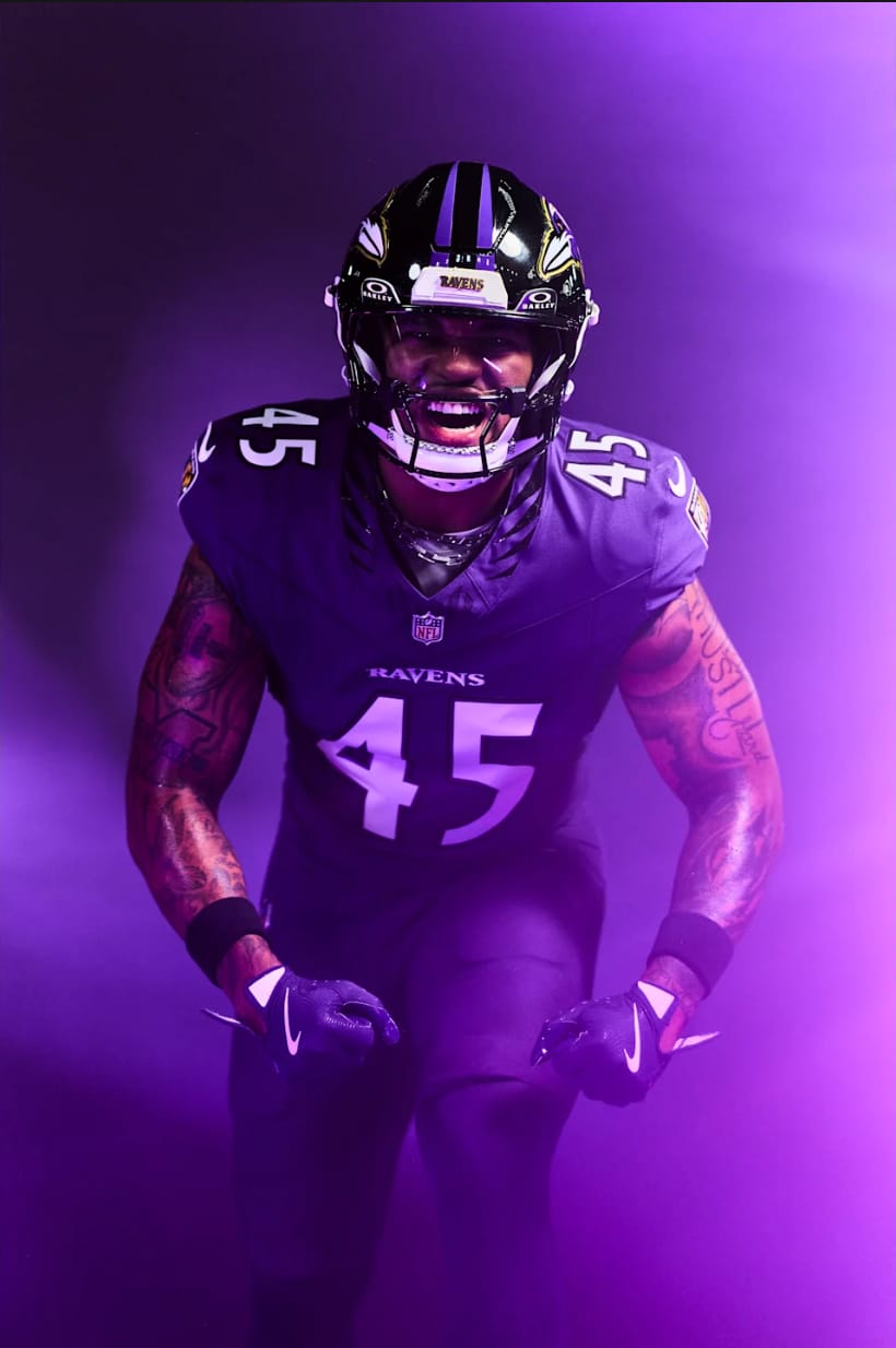 Baltimore Ravens 2026 primary home purple uniform player portrait with black helmet and new Raven Wings collar pattern