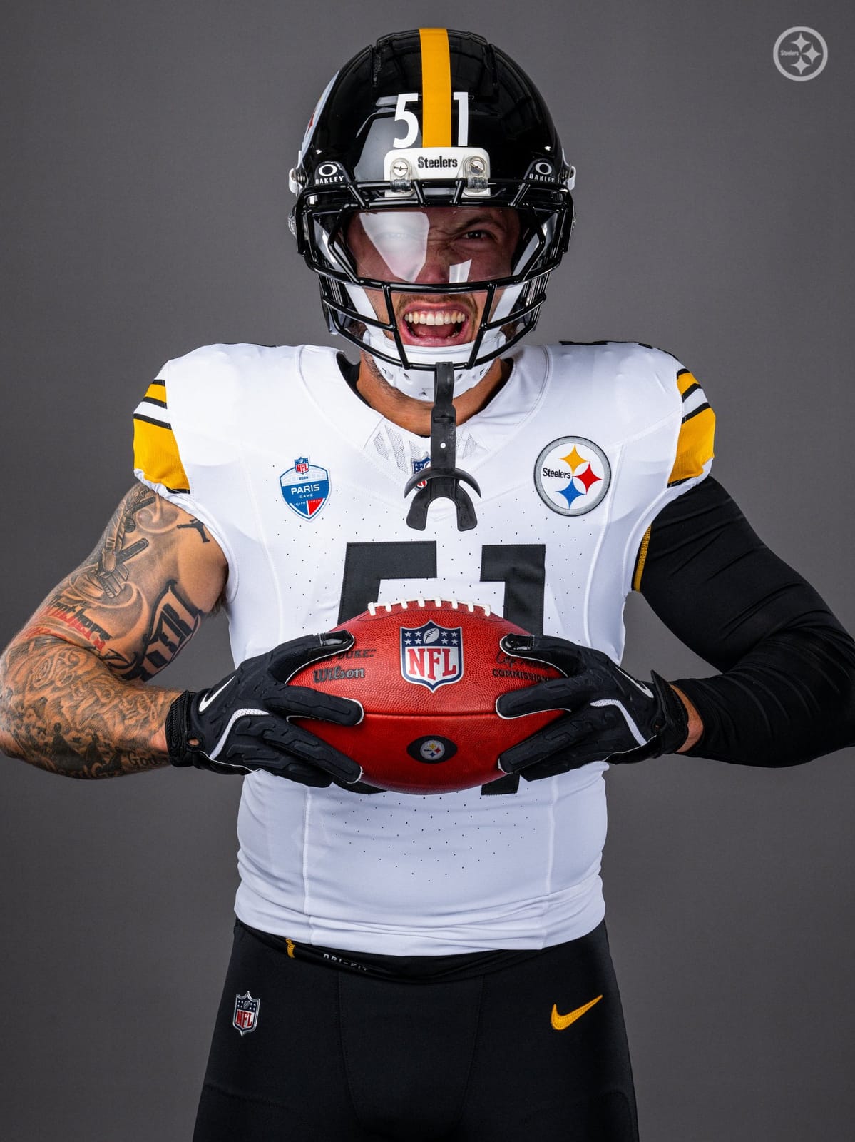 Steelers linebacker Nick Herbig in the white jersey and black pants for the 2026 Paris game, with the NFL Paris patch on the chest