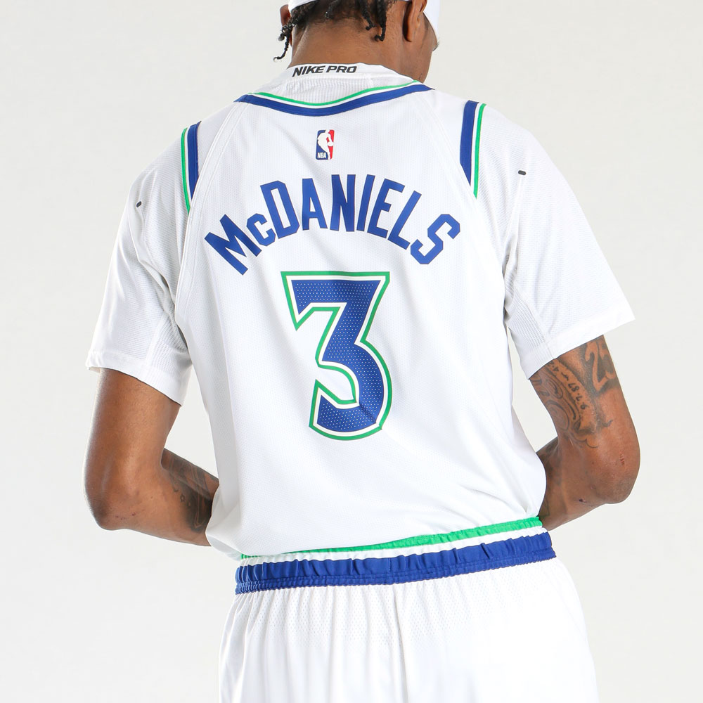 Minnesota Timberwolves new white home jersey 2026-27 back view with the McDaniels nameplate and #3 number in blue with green outline matching the throwback wordmark treatment on the front, clean white shoulders with no tree print on the jersey body