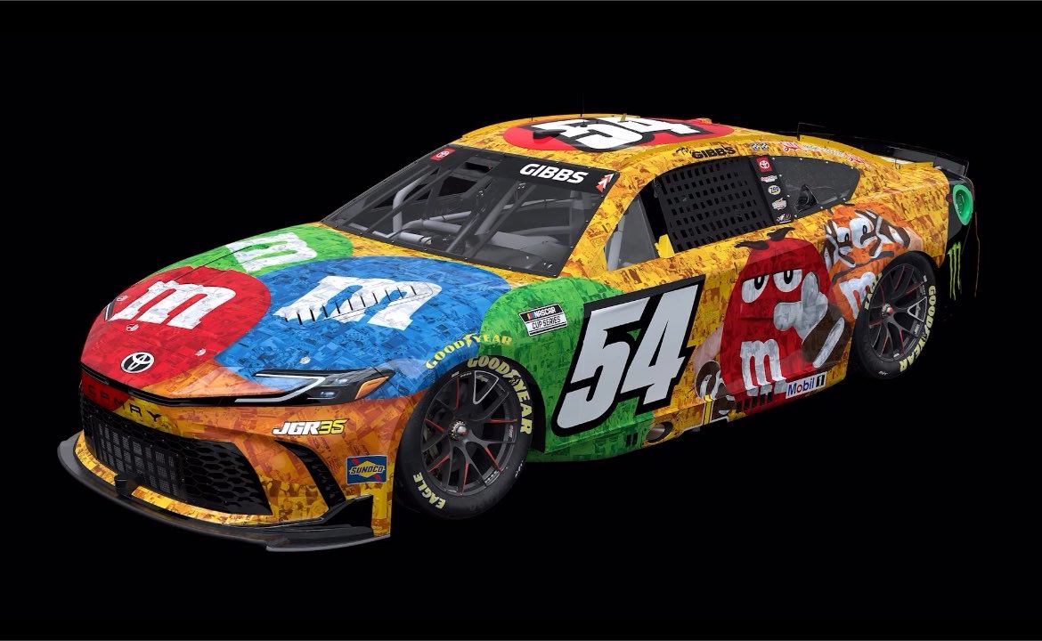 Full side view of the No. 54 M&M's Kyle Busch tribute Toyota Camry, showing the M&M's characters on the rear quarter, the JGR35 mark on the front fender and the white 54 with a black outline on the door