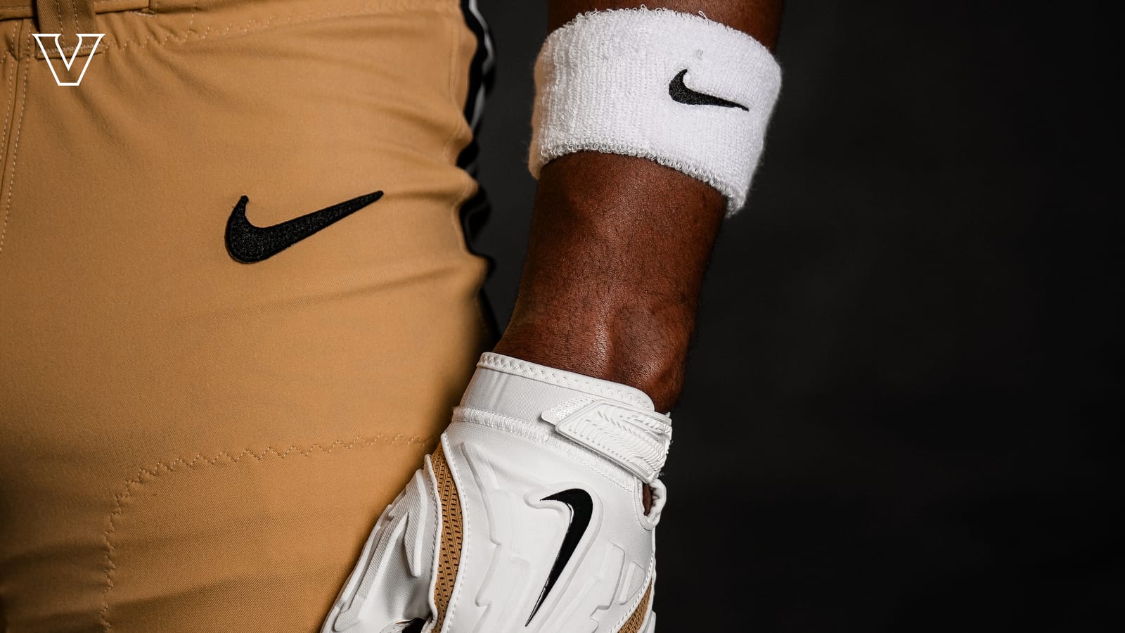 The gold pants, black Nike swoosh, and black side stripe on the Vanderbilt Commodores 2026 all-gold football uniform