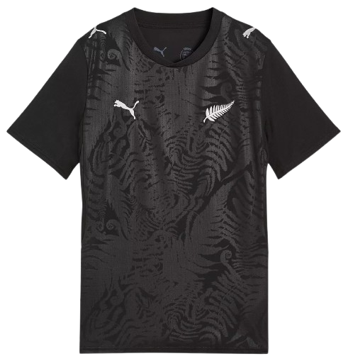New Zealand 2026 World Cup Puma black change jersey with a tonal koru and fern pattern and the silver fern crest worn in the Group G match vs Iran at SoFi Stadium in Los Angeles