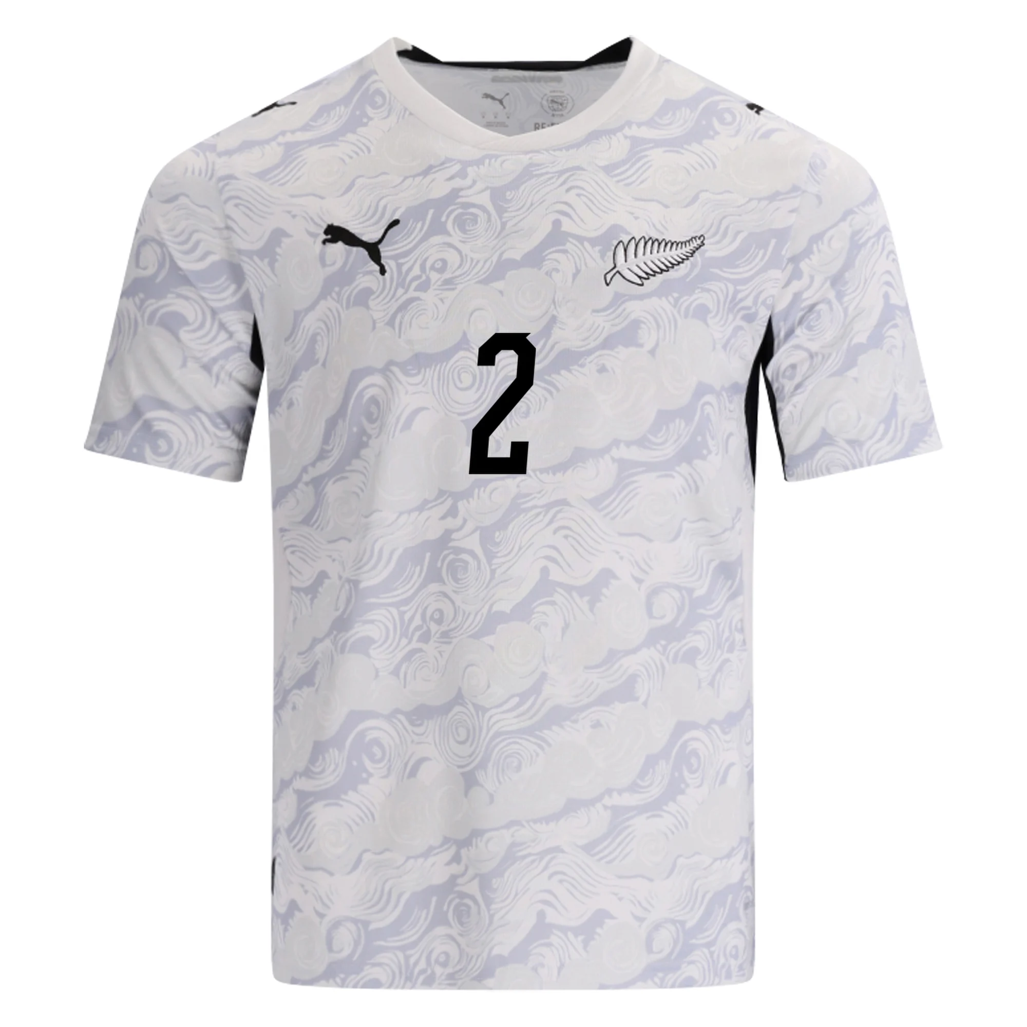 New Zealand 2026 World Cup white Puma change jersey with a tonal cloud-and-fern pattern and the silver fern crest, worn in the Group G match vs Belgium
