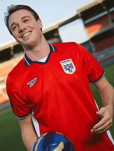 Panama 2026 World Cup red Reebok home jersey with navy collar and cuff trim and the Panama crest, worn in the Group L match vs Ghana