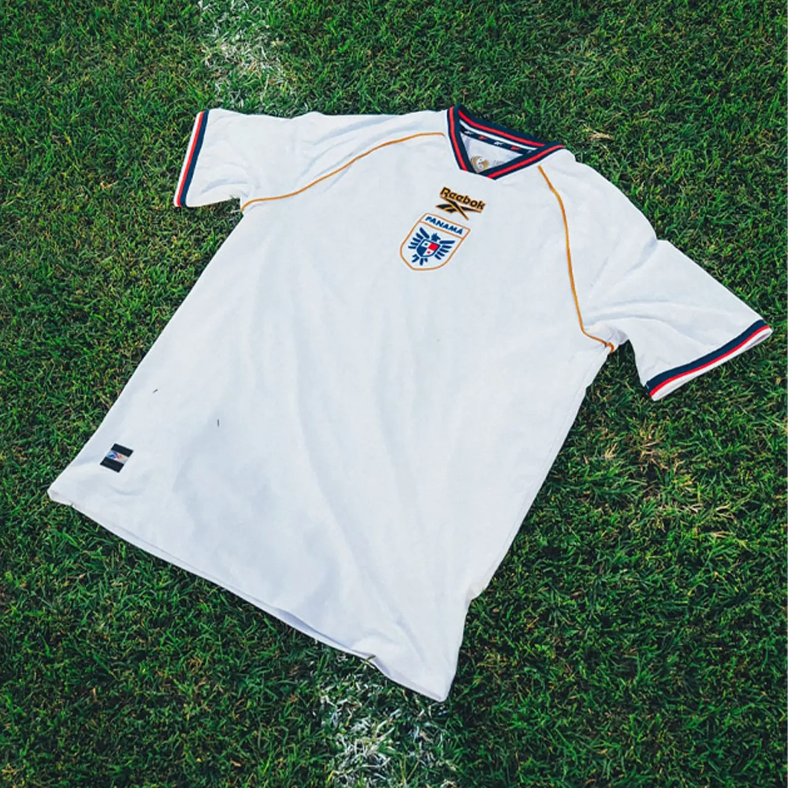 Panama 2026 World Cup white Reebok away jersey with navy and red collar trim and gold piping, worn in the Group L match vs England