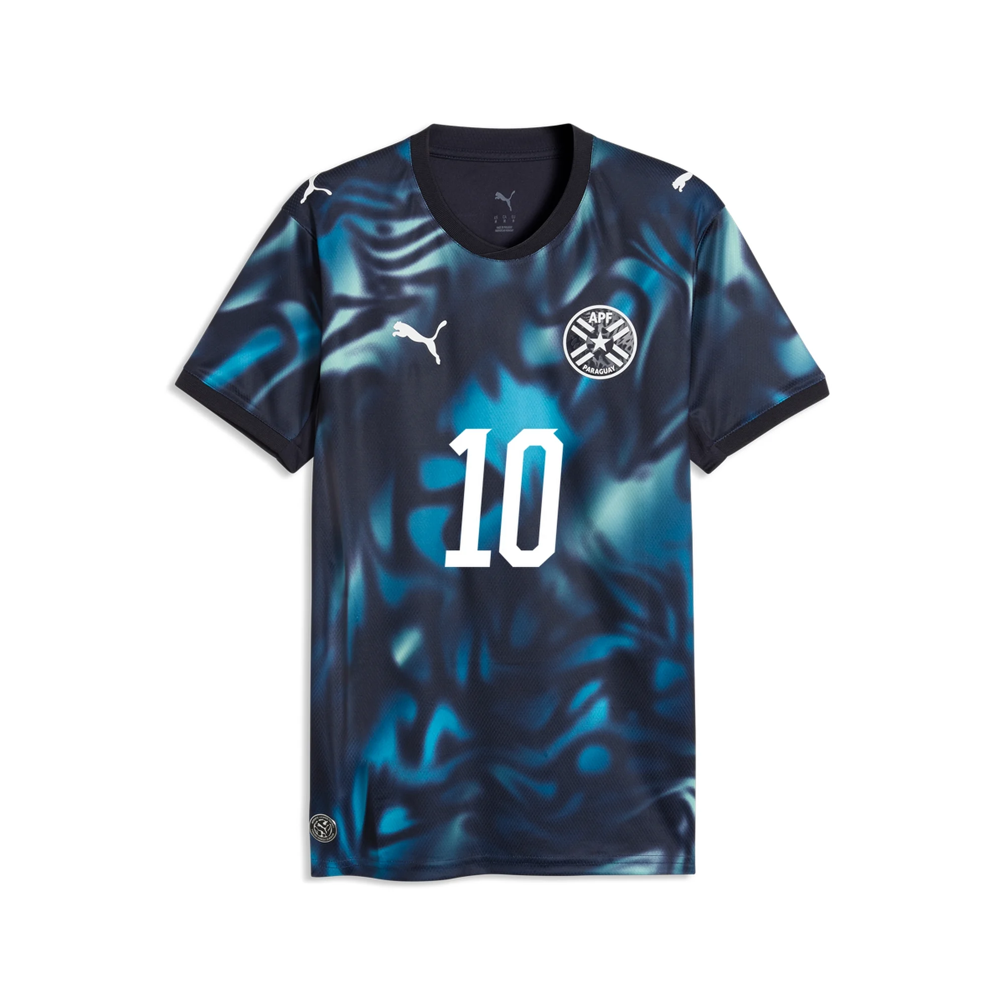 Paraguay 2026 World Cup navy and teal Puma change jersey with a marbled print and the APF crest, worn in the Round of 32 vs Germany