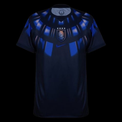 Uruguay 2026 World Cup dark navy Nike away jersey with bright blue sunburst rays and the four-star crest, worn in the Group H match vs Spain