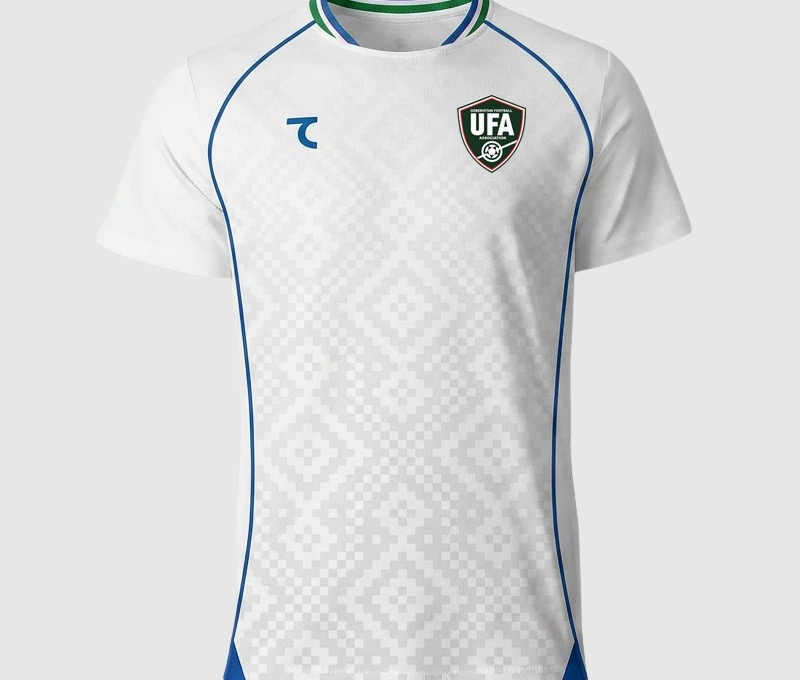 Uzbekistan 2026 World Cup white away jersey with blue and green trim and the UFA crest, worn in the Group K match vs Congo DR