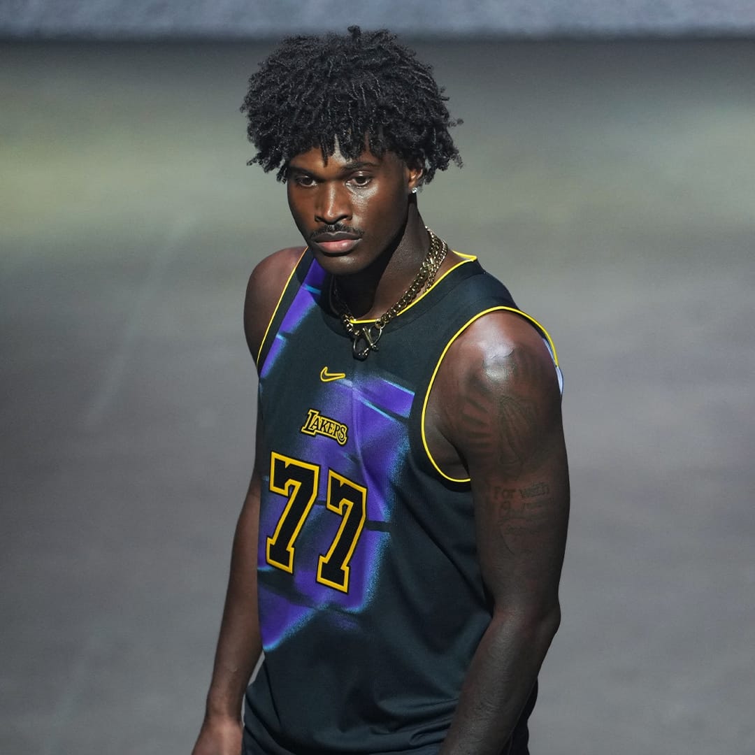 Los Angeles Lakers 2026-27 Specter Edition jersey: black base with purple streaks, gold 77 and gold LAKERS wordmark
